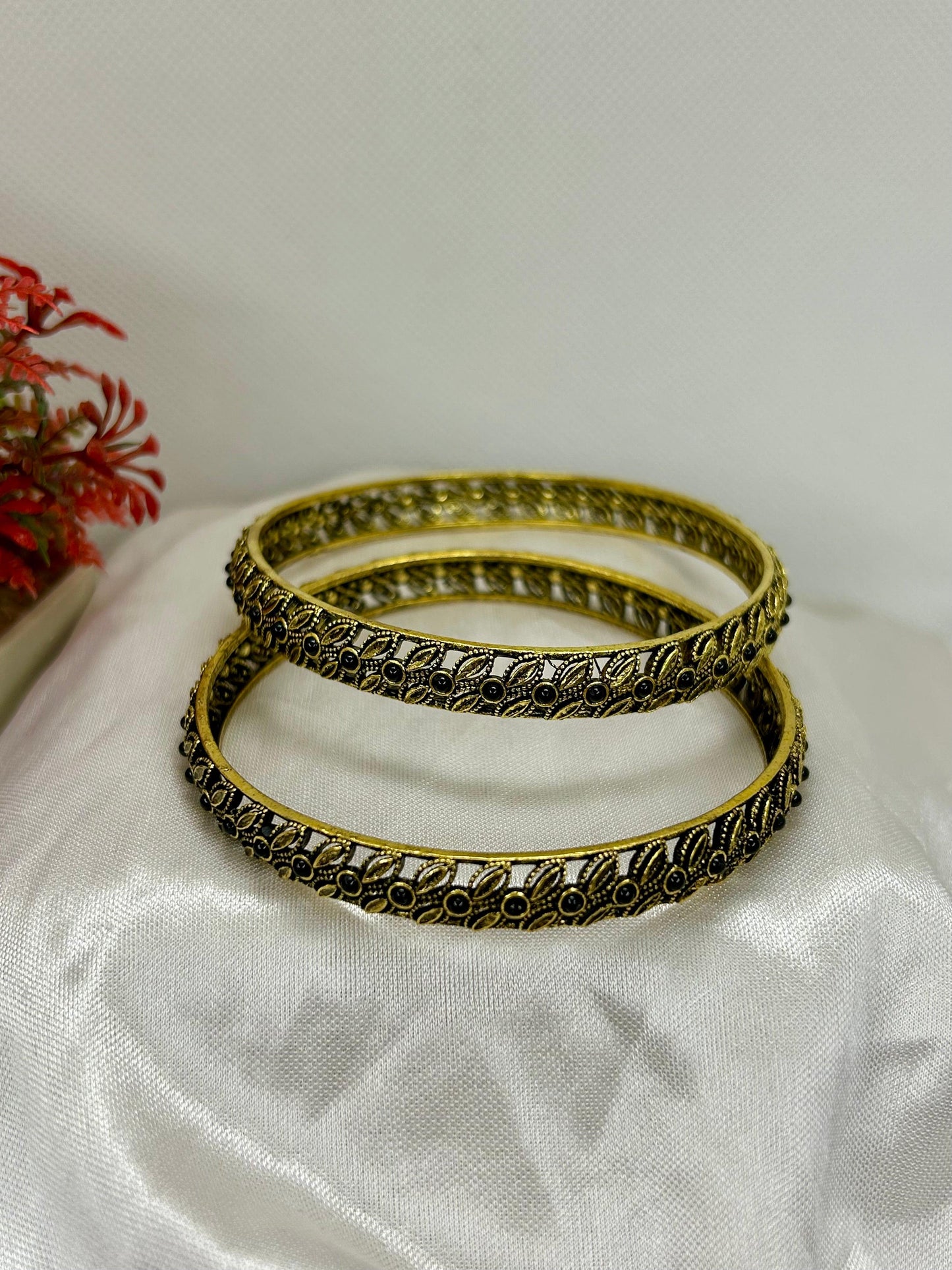 Pair of Gold Look Stainless-Steel Bangles with Leafy Pattern